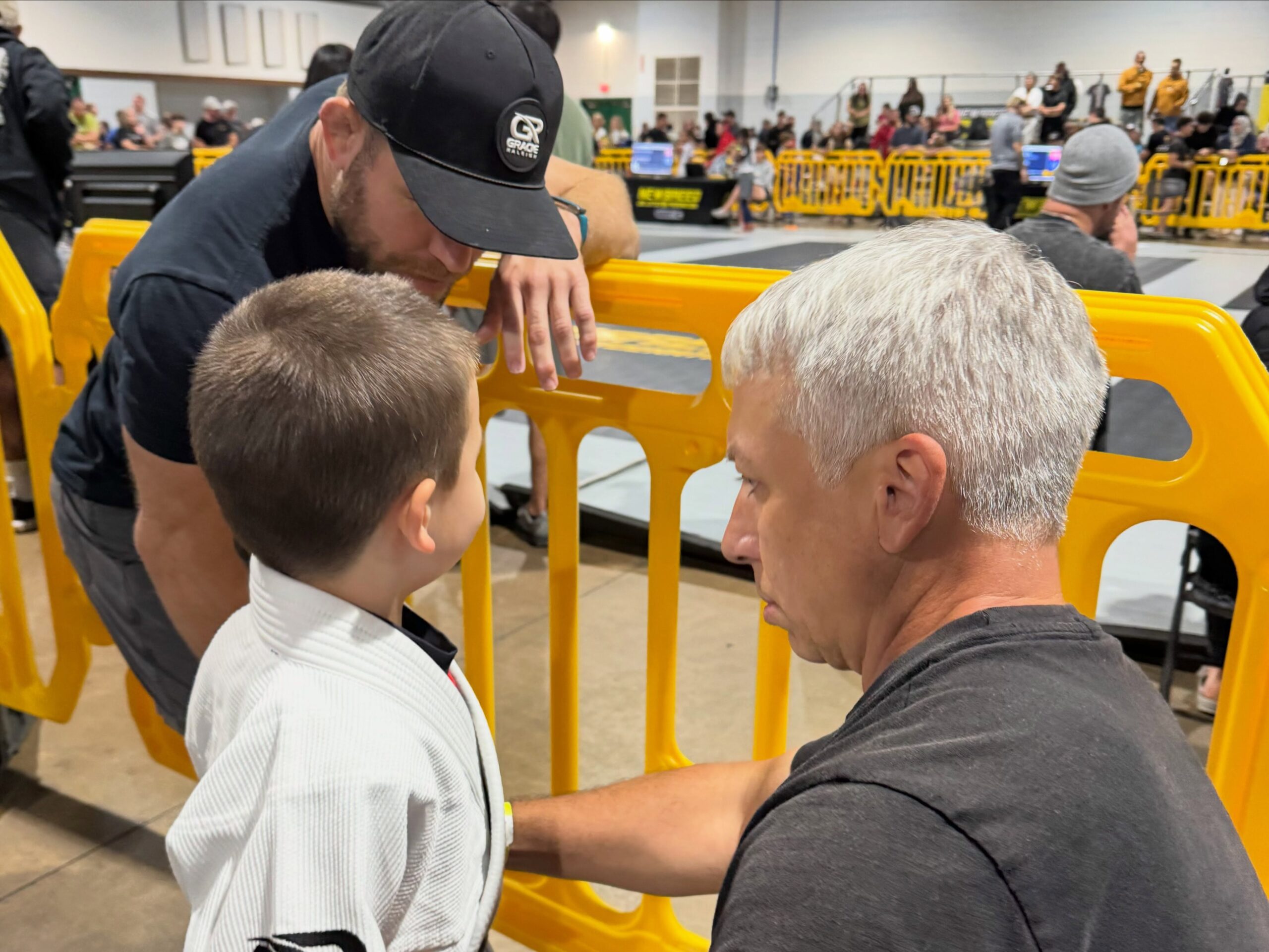 Gracie Raleigh coach encourages a young Brazilian Jiu-Jitsu student before a match at the NEWBREED tournament in North Carolina.